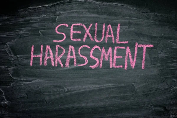 The words Sexual Harassment on a blackboard — Stock Photo, Image