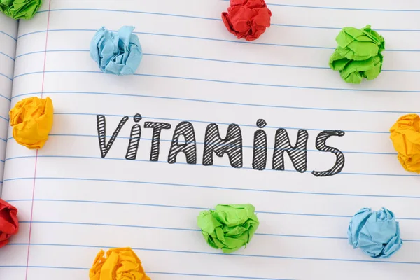 The word Vitamins on notebook sheet — Stock Photo, Image