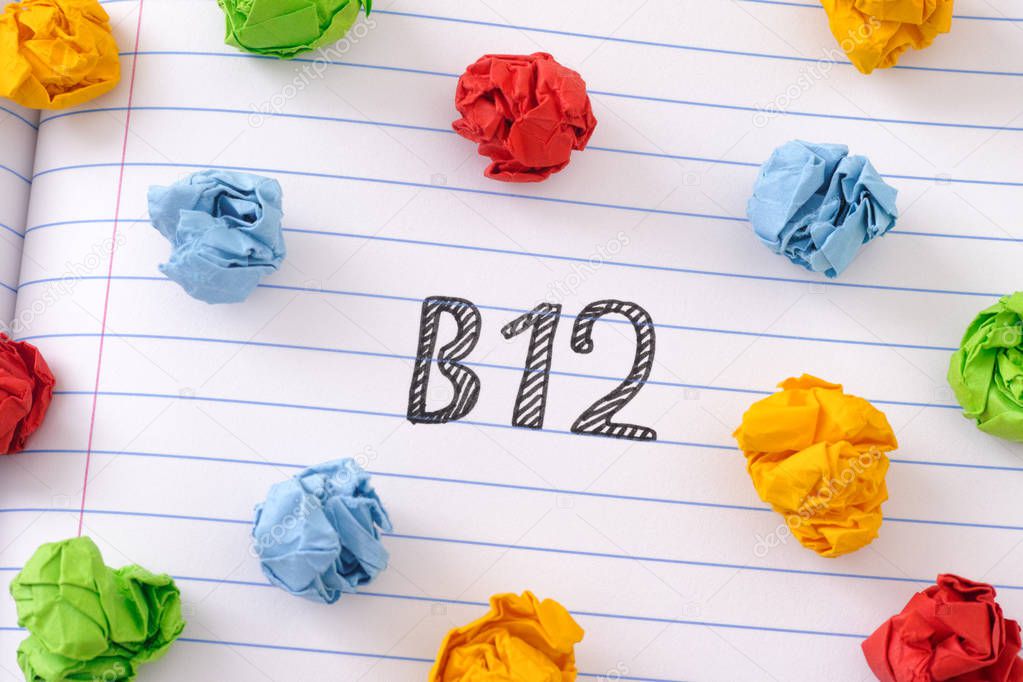 The word Vitamin B12 on notebook sheet