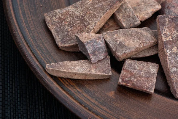 Heap of cacao paste on a plate — Stock Photo, Image