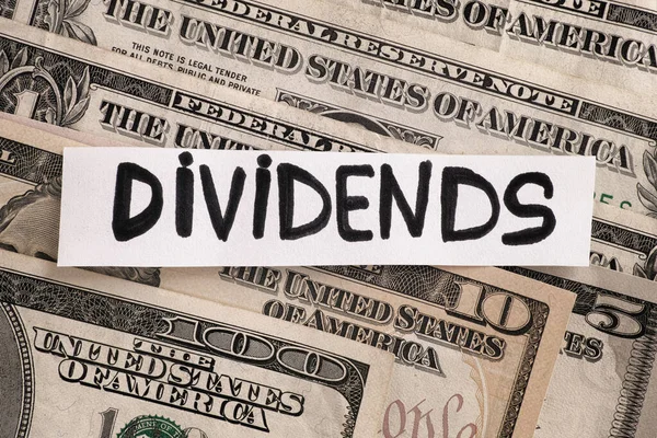 Word Dividends Dollar Bills Close — Stock Photo, Image