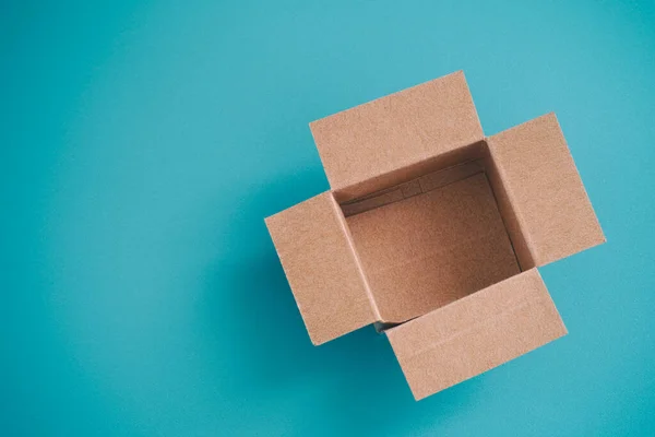 Open Cardboard Box Blue Background — Stock Photo, Image