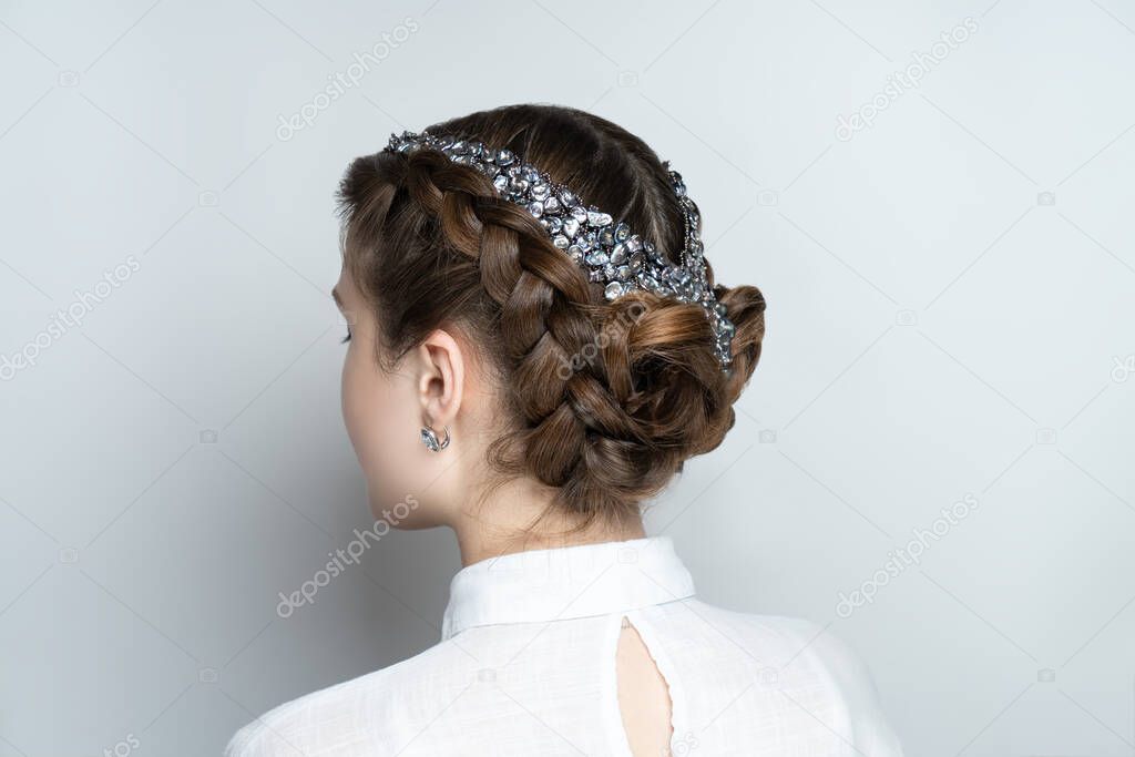Close-up portrait beauty girl woman lady, volume hair-do. Luxury hair styling. new concept. Woman medium length hair. Wedding hairstyle gathered hair-do braided flowers. Beautiful bride style creative