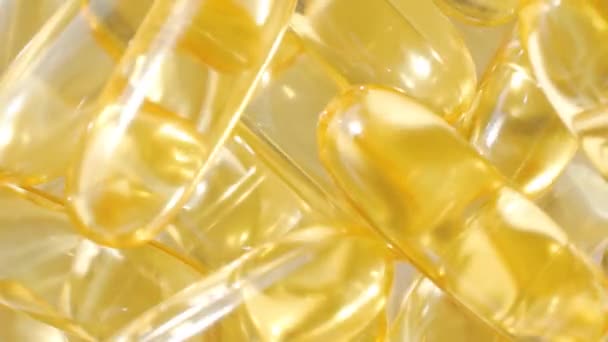 Omega 3 gélules. Contexte. Macro. Gros plan — Video