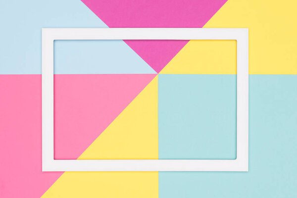 Abstract geometry flat lay pastel blue, pink and yellow paper texture minimalism background. Minimal geometric shapes and lines template with empty picture frame mock up.