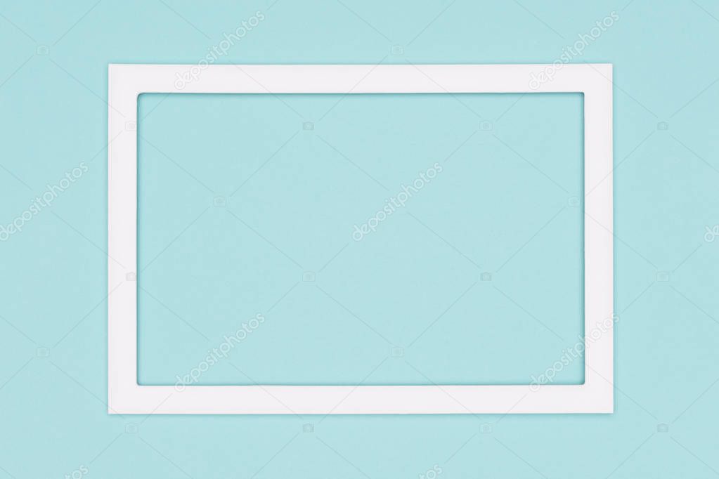 Abstract flat lay pastel blue colored paper texture minimalism background. Minimal template with empty picture frame mock up.