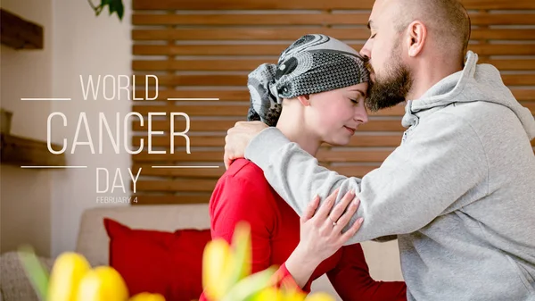 Supportive husband kissing his wife, cancer patient, after treatment in hospital. Cancer and family support concept. World Cancer Day Banner.