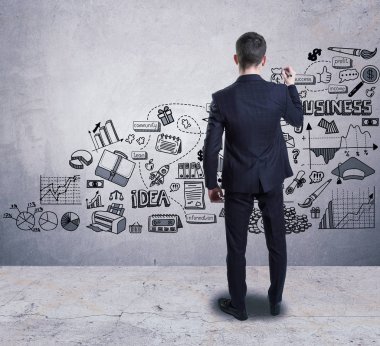 Bir iş adamı duvara bir iş kroki çizim