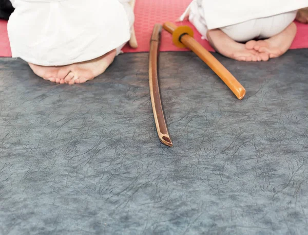 People in kimono on martial arts weapon training seminar — Stock Photo, Image