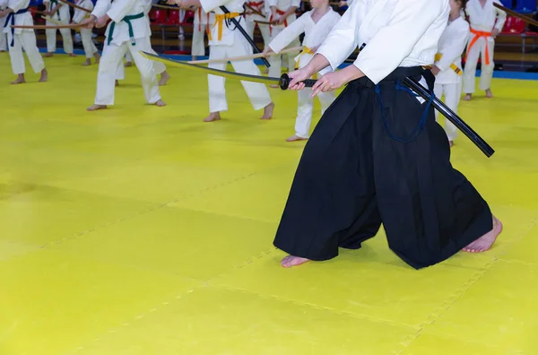 People in kimono on martial arts weapon training seminar — Stock Photo, Image