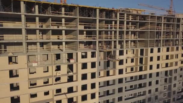 Construction site of a new residential complex. Flying alonge the construction site — Stock Video