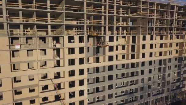 Construction site of a new residential complex. Flying alonge the construction site — Stock Video