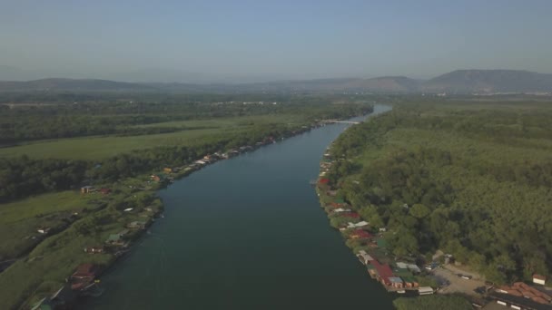 Floating restaurants and guesthouses located on the river bank — Stock Video