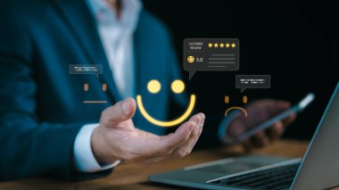 A businessman using digital icons of customer feedback and star ratings, symbolizing online reviews, client satisfaction, brand reputation, and customer experience management in modern business strategy.