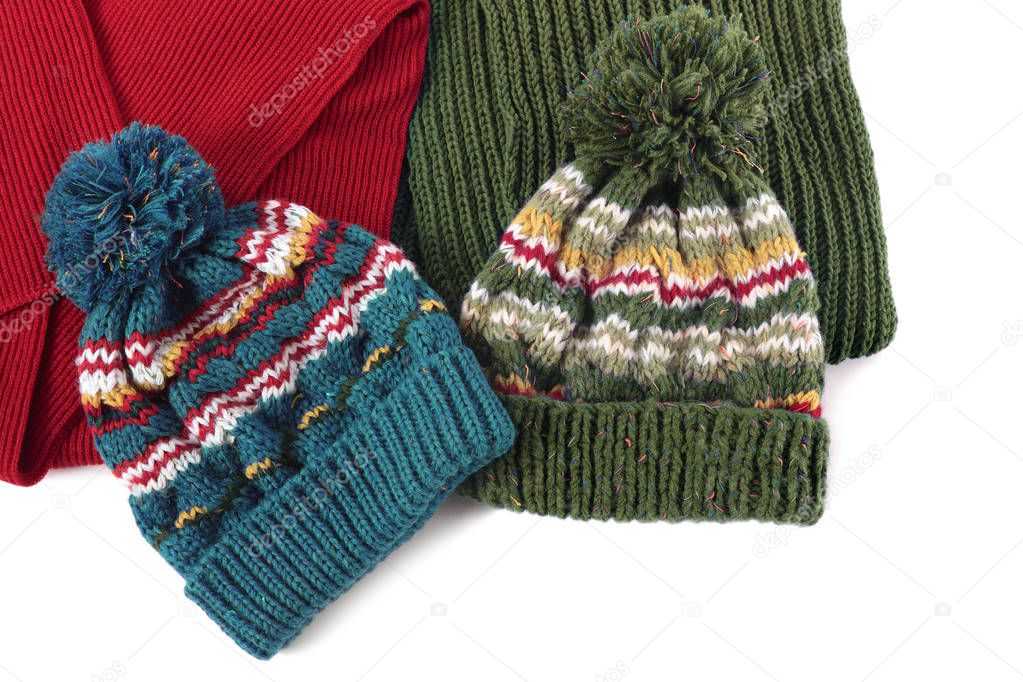 Two bobble ski hats and scarves isolated 