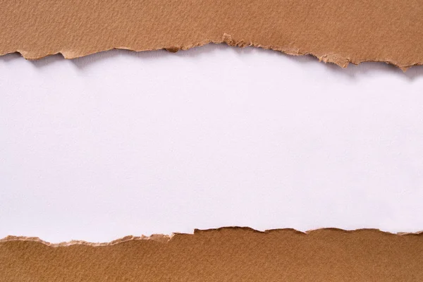 Torn brown paper center strip white background