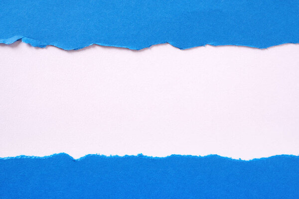 Torn blue paper strip straight edge border flat