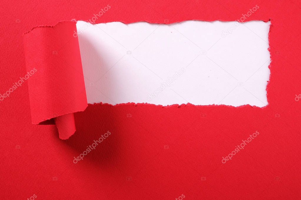 Torn red paper strip curled edge border white background