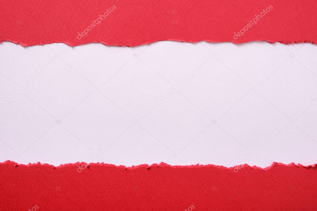 Torn red paper strip center ripped edge white background