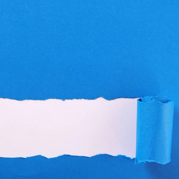 Torn blue paper strip curled edge border frame — Stock Photo, Image