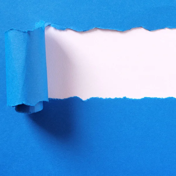 Torn blue paper strip headline white background frame