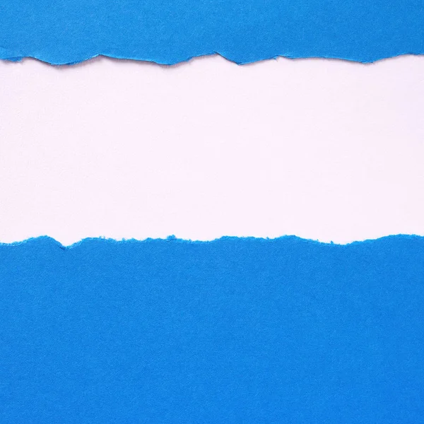 Torn blue paper strip untidy edge border frame vertical — Stock Photo, Image