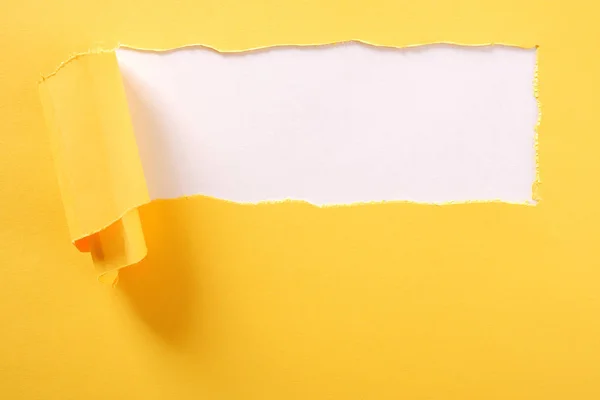 Torn yellow paper strip white background ripped — Stock Photo, Image