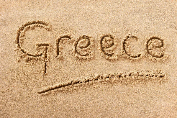 Grecia spiaggia scritta a mano sabbia messaggio — Foto Stock