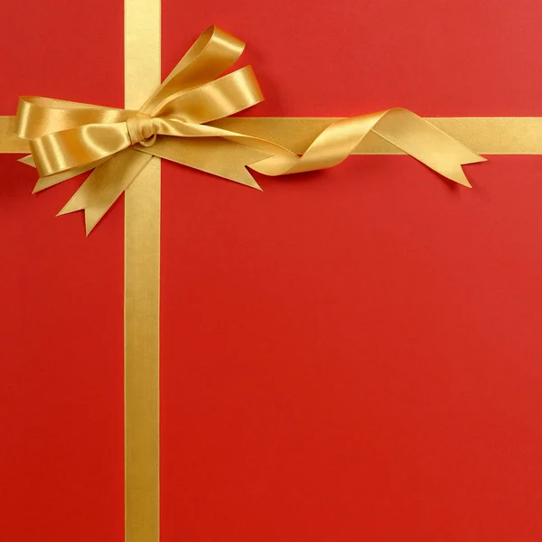 Natale regalo bordo oro nastro fiocco rosso sfondo verticale — Foto Stock