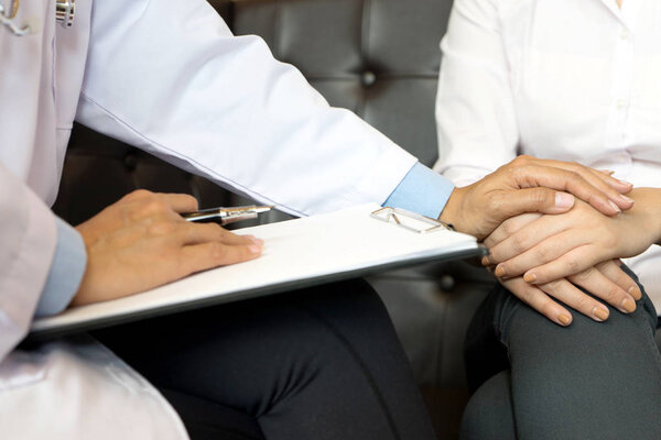 The doctor held touch the patient  hand to Encouragement
