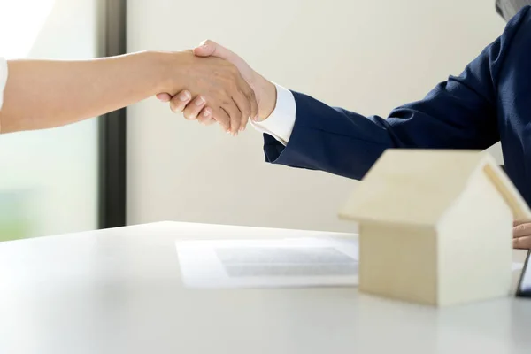 business man woman hand shake for agreement home rent