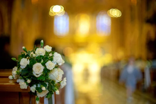 white flower with blur church background wedding ceremony