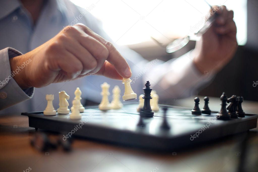 image of hands confident businessman  playing chess game to development analysis new strategy plan, leader and teamwork concept for success
