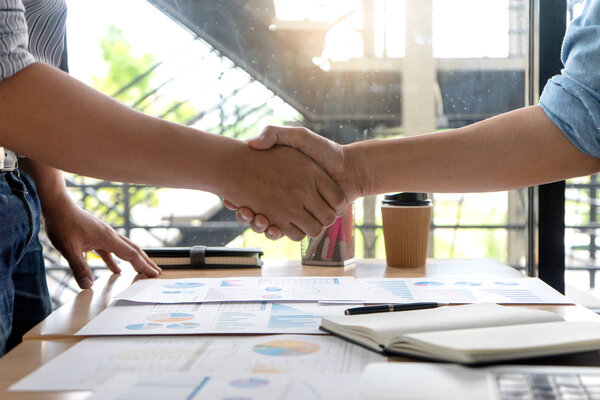 businessman hand shake with another business man show their corporation