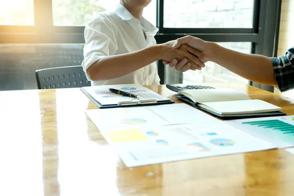 businessman hand shake with another business man woman