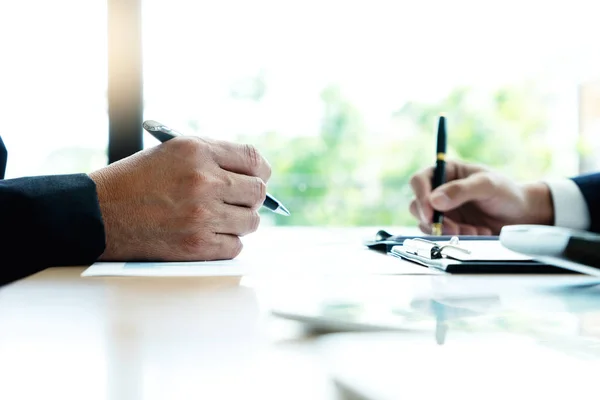 Young business team in a small meeting in the office — Stock Photo, Image