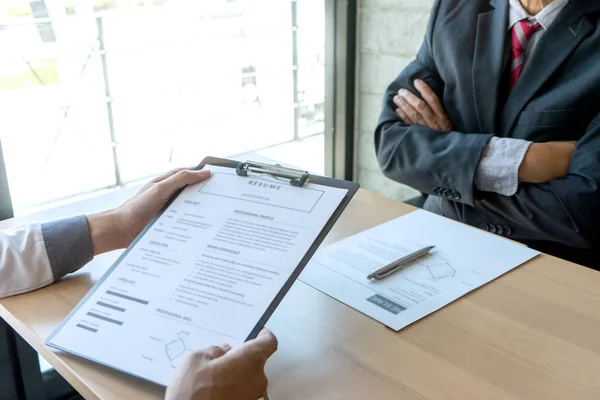 Job interview with corporate business manager arms folded