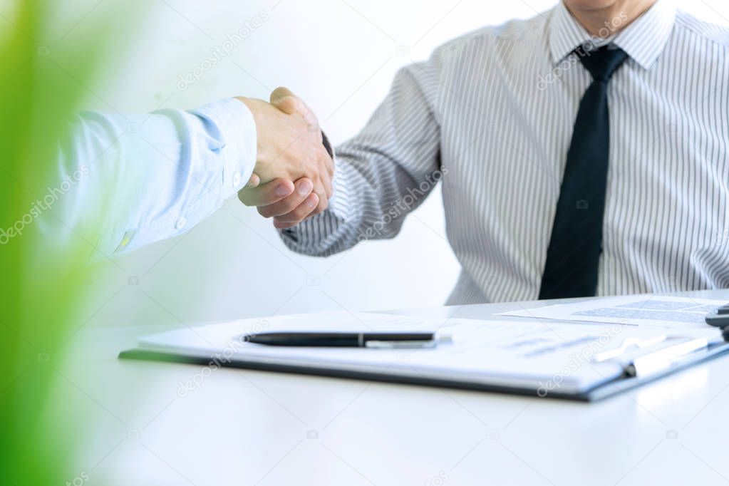 in the office handshake of Real estate agent and customers  in m