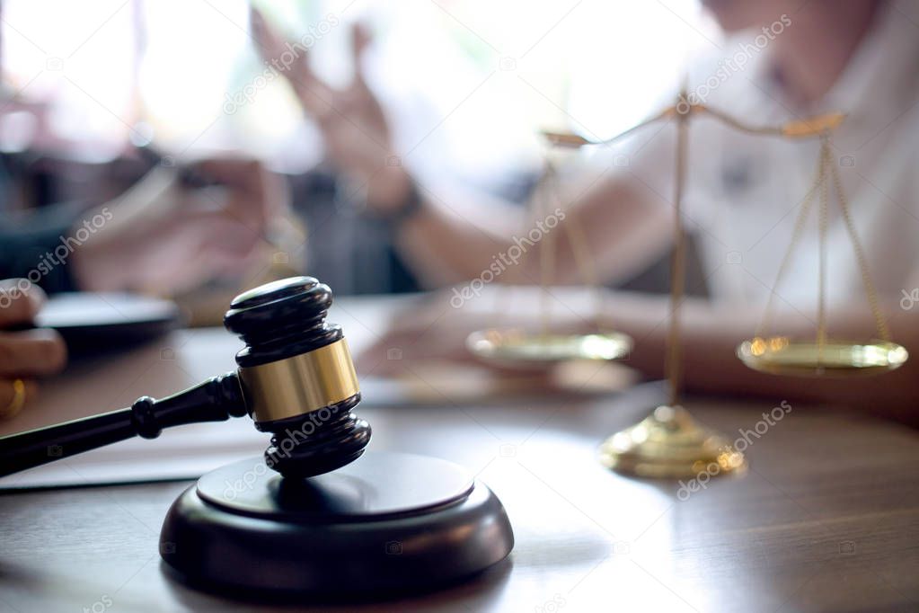 Lawyer or judge gavel with balance handshake 