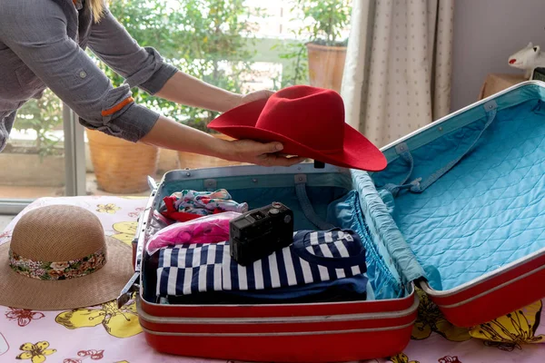 Girl packing luggage preparing for her trip 1308489 Stock Photo at