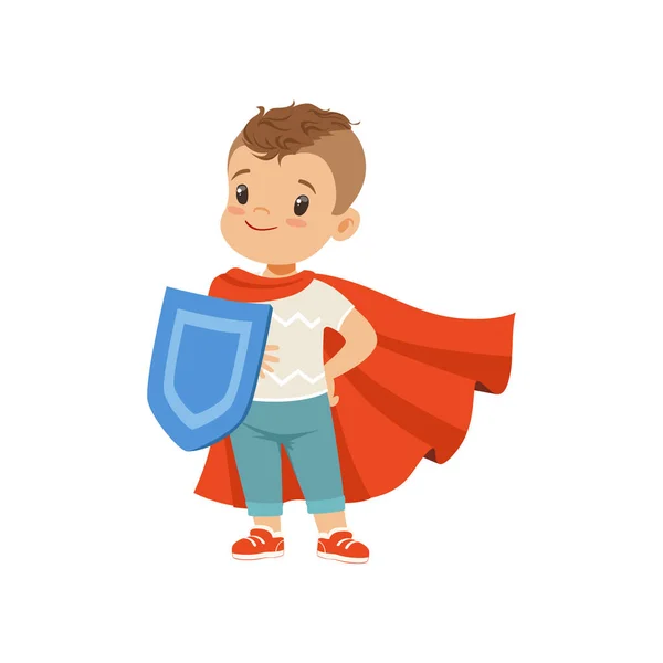 Cute brave little boy character in red cape standing with shield vector Illustration on a white background — Stock Vector