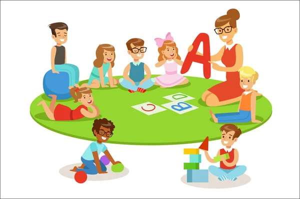 Young Children Learning Alphabet And Playing In Nursery School With Teacher Sitting And Laying On The Floor — Stock Vector