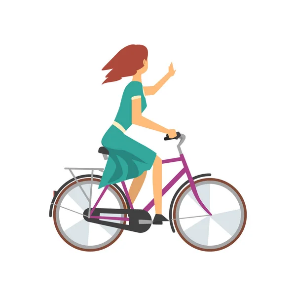 Young Woman in Green Dress Riding Bike and Waving Her Hand, Female Cyclist Character on Bicycle Vector Illustration — Stock Vector