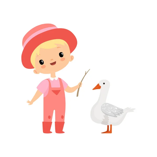 Schattige jongen in overalls, rubberen laarzen en hoed grazende gans, jonge boer cartoon karakter bezig met agrarische activiteiten vector illustratie — Stockvector