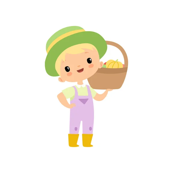 Cute Boy in Overalls, Rubber Boots and Hat with Basket of Fresh Vegetables, Young Farmer Cartoon Character Harvesting Vector Illustration — Stock Vector