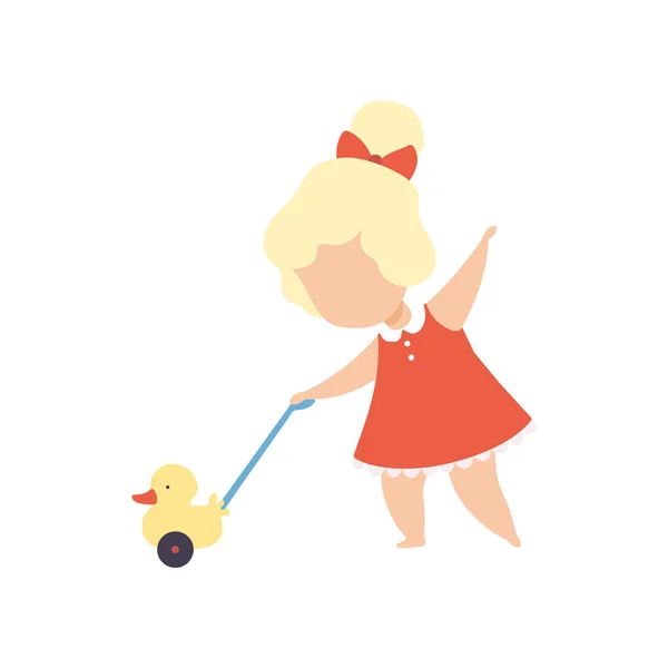 Schattige kleine blonde meisje spelen met Toy Duck vector illustratie — Stockvector