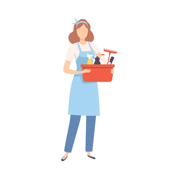 Limpiador profesional femenino de pie con cesta de detergentes, personaje del personal de la empresa de limpieza vestido de uniforme con equipo plano Vector Ilustración — Vector de stock