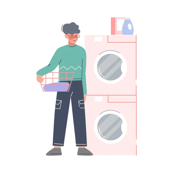 Fiatal férfi csinál mosoda otthon vagy a nyilvános mosoda, Guy holding kosár piszkos ruhák álló mellett mosógép és szárító Flat Style vektor illusztráció — Stock Vector
