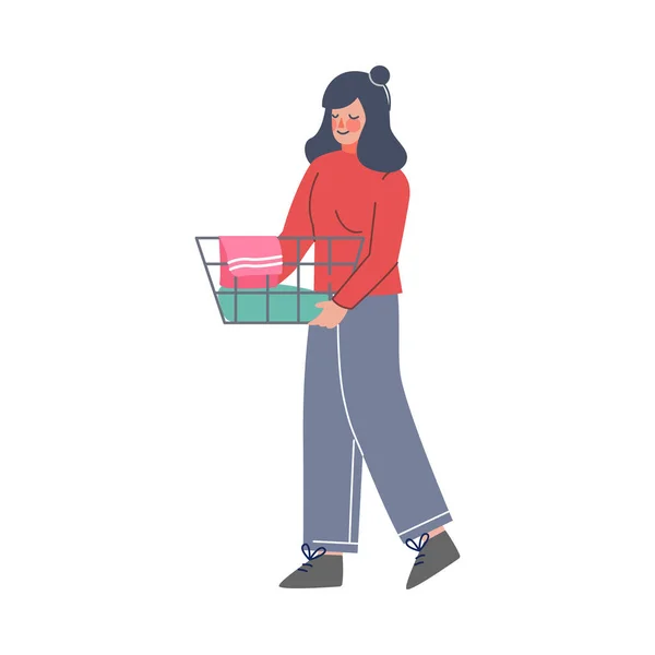 Ragazza che fa lavanderia a casa o in lavanderia pubblica, donna che trasporta cestino di vestiti sporchi stile piatto vettoriale illustrazione — Vettoriale Stock