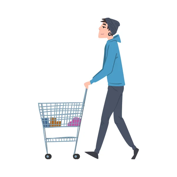 Junger Mann geht mit Einkaufswagen, Kerl Einkaufen in Einkaufszentrum oder Supermarkt Cartoon Style Vector Illustration auf weißem Hintergrund — Stockvektor